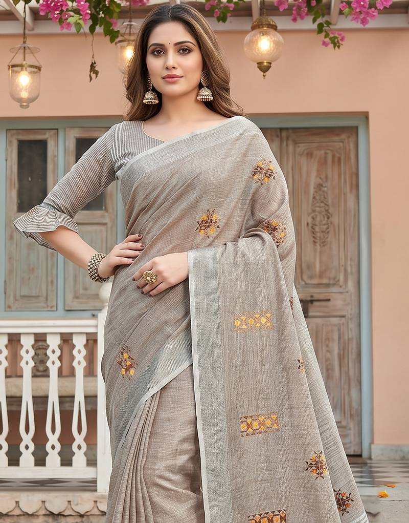 women brown linen saree with floral embroidery border & tassels