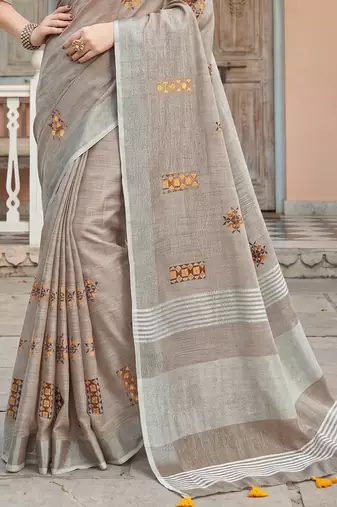 women brown linen saree with floral embroidery border & tassels