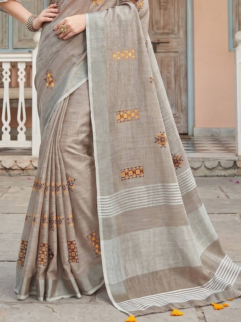 women brown linen saree with floral embroidery border & tassels