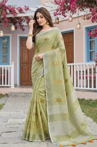 women light green linen saree with floral embroidery border & tassels