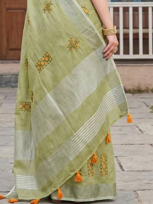 women light green linen saree with floral embroidery border & tassels 4