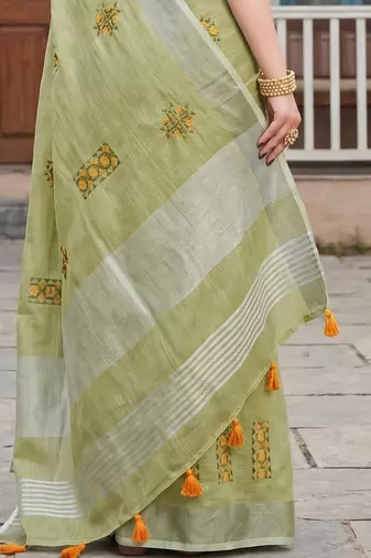 women light green linen saree with floral embroidery border & tassels