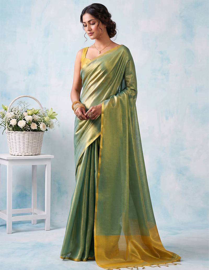 women teal green & gold-toned solid tissue silk blend saree with zari border