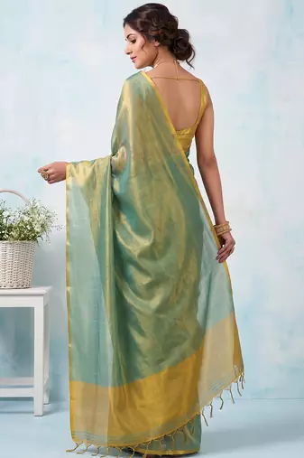 women teal green & gold-toned solid tissue silk blend saree with zari border