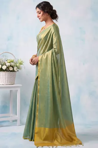 women teal green & gold-toned solid tissue silk blend saree with zari border