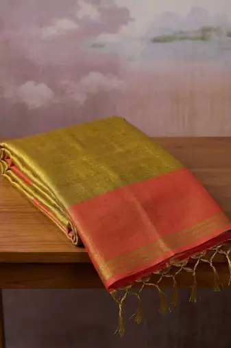 women mustard yellow & orange solid tissue silk blend saree with contrast border