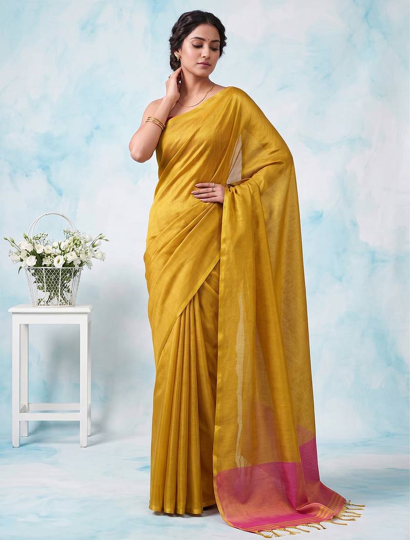women bright yellow & pink solid tissue silk blend saree with zari border