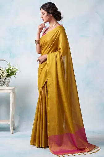 women bright yellow & pink solid tissue silk blend saree with zari border
