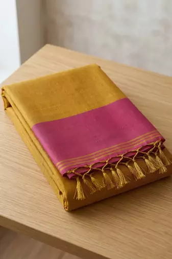 women bright yellow & pink solid tissue silk blend saree with zari border