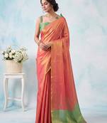 women coral peach & green solid tissue silk blend saree with contrast border