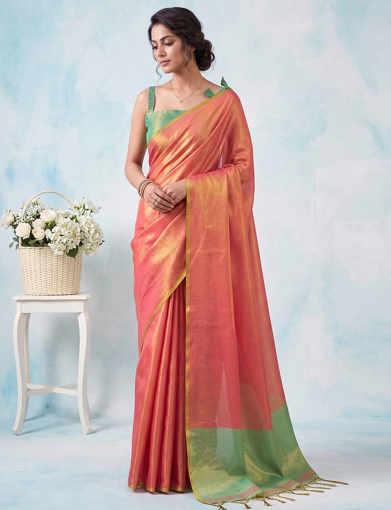 women coral peach & green solid tissue silk blend saree with contrast border