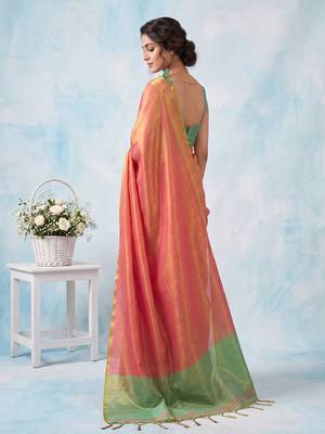 women coral peach & green solid tissue silk blend saree with contrast border 2