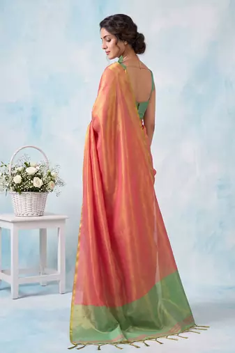 women coral peach & green solid tissue silk blend saree with contrast border