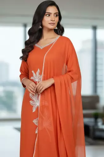 Womens orange self design cotton fabric kurta set 3/4 sleeves round neck