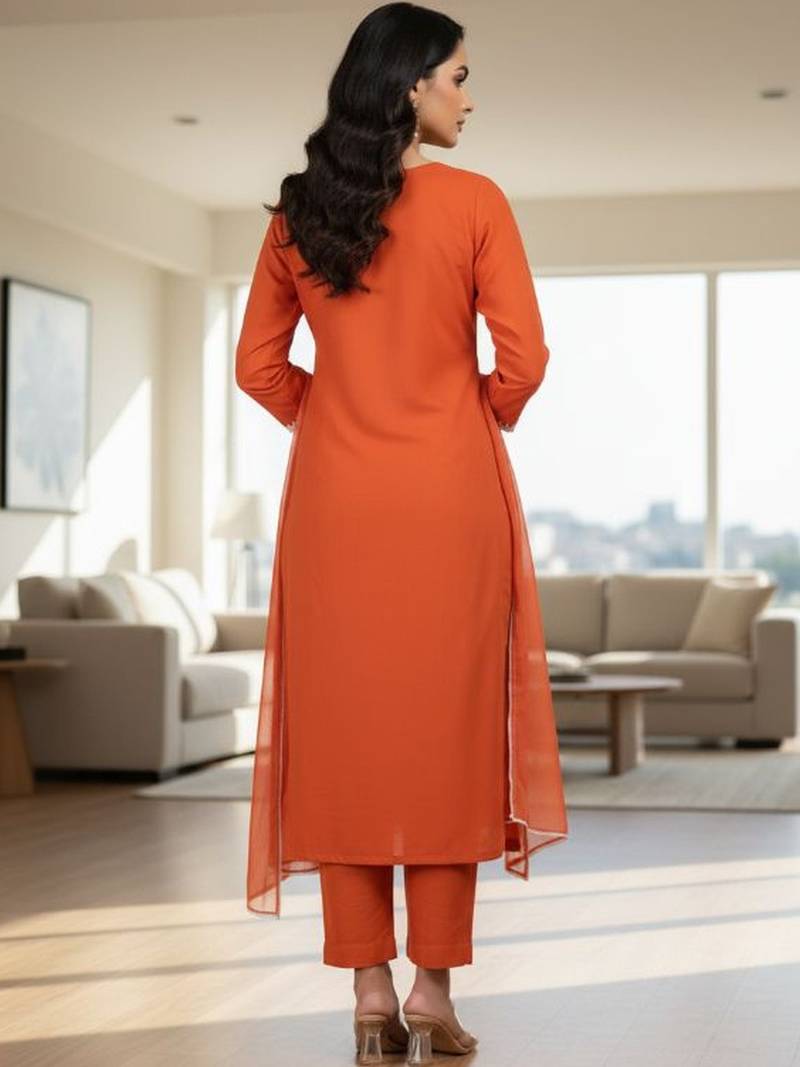 Womens orange self design cotton fabric kurta set 3/4 sleeves round neck