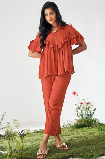 Orange ruffle top and pants co-ord set