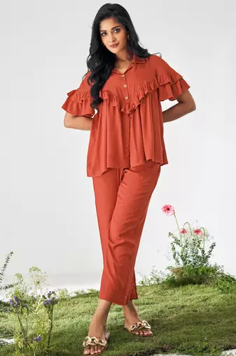Orange ruffle top and pants co-ord set