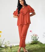 Orange ruffle top and pants co-ord set