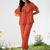 Orange ruffle top and pants co-ord set