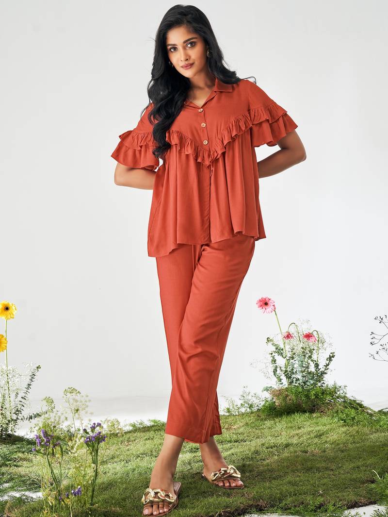 Orange ruffle top and pants co-ord set
