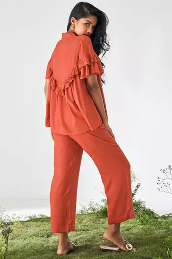 Orange ruffle top and pants co-ord set