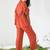 Orange ruffle top and pants co-ord set