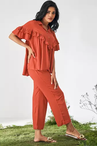 Orange ruffle top and pants co-ord set