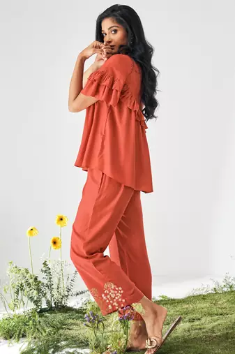 Orange ruffle top and pants co-ord set
