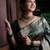 Green silk blend banarasi saree with unstitched blouse piece