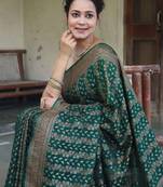 Green silk blend banarasi saree with unstitched blouse piece