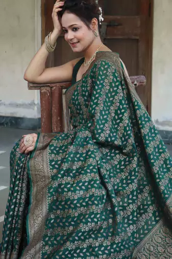 Green silk blend banarasi saree with unstitched blouse piece