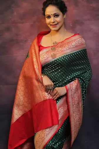Green silk blend banarasi saree with unstitched blouse piece