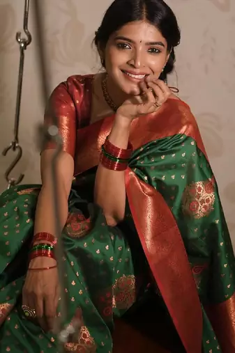 Green silk blend banarasi saree with unstitched blouse piece