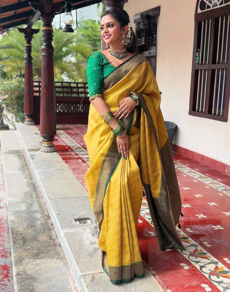 Yellow soft silk blend banarasi jacuard work designer party wear saree with unstitched blouse piece