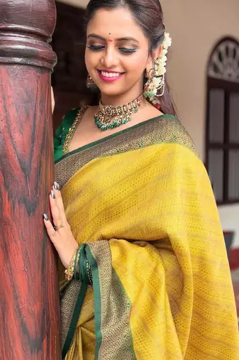 Yellow silk blend banarasi saree with unstitched blouse piece