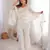 Women   s white embroidered kurta with bell bottom pant & dupatta set