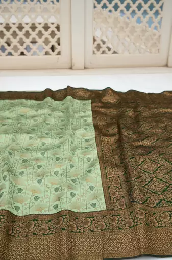 Pista green silk blend banarasi saree with unstitched blouse piece