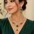 Gold finish electric green diamond necklace set