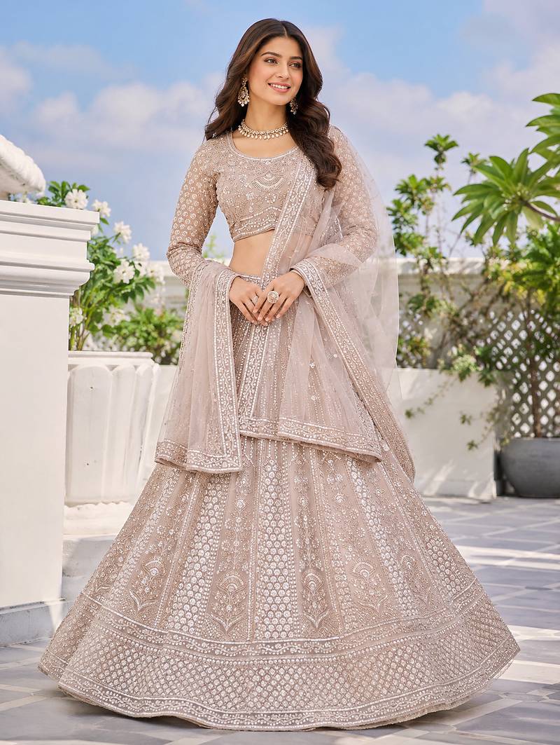 Luxury Beige Net Lehenga Choli with Allover Beads & Dori Embellishment