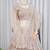 Luxury Beige Net Lehenga Choli with Allover Beads & Dori Embellishment