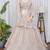 Luxury Beige Net Lehenga Choli with Allover Beads & Dori Embellishment