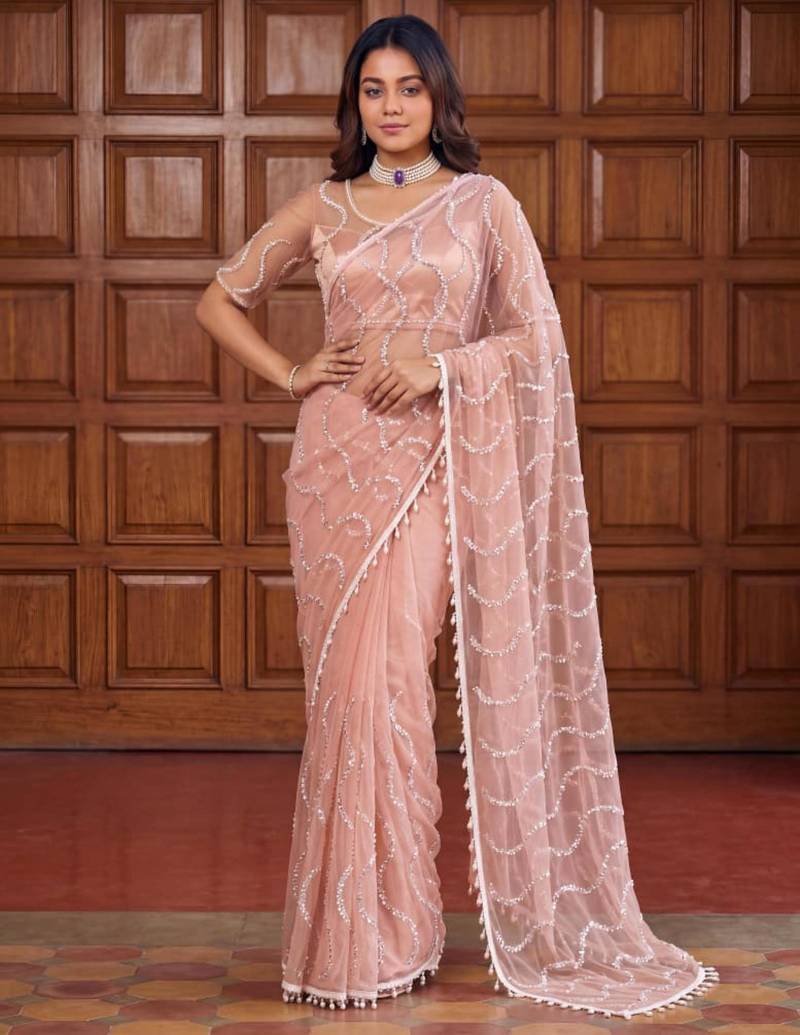 Beige net embroidered saree with sequins work