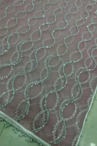 Baby pink net embroidered saree with sequins work