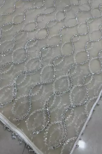 Cream net embroidered saree with sequins work