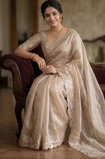 Beige silk blend embroidered saree with thread work