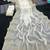 White satin embroidered saree with sequins work