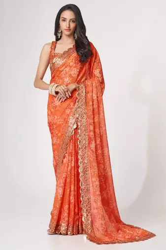 Orange organza printed saree with sequins work