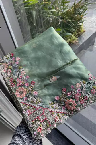 Sea green tissue embroidered saree with thread work