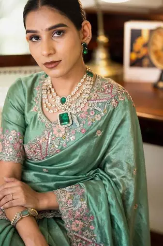 Sea green tissue embroidered saree with thread work