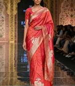 Orange silk blend printed saree with zari work